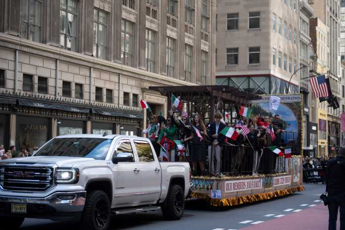 parade float pulled by pickup truck