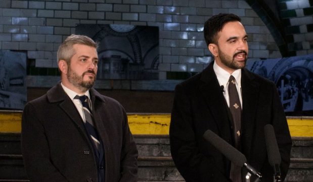 NYCDOT Commissioner Mike Flynn standing with Mayor Zohran Mamdani during the mayor's swearing-in ceremony at the old City Hall subway station on Jan. 1, 2026. (Evan Simko-Bednarski / New York Daily News)