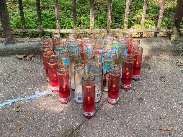 A candle memorial for Shatavia Walls is pictured near her home on Sunday, July 19. (Catherina Gioino for New York Daily News)