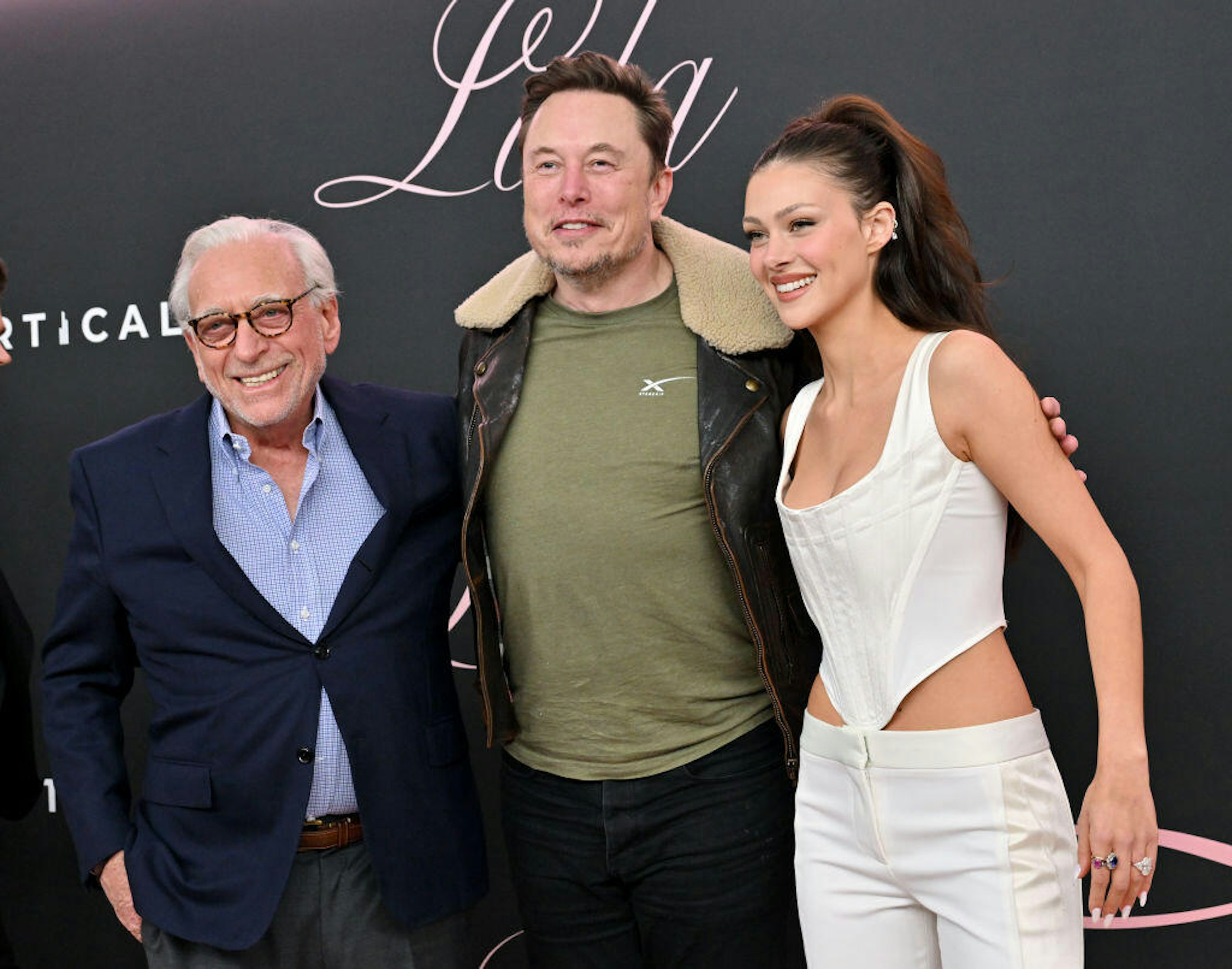 (L-R) Nelson Peltz, Elon Musk and Nicola Peltz Beckham attend the Premiere of "Lola" at Regency Bruin Theatre on February 03, 2024 in Los Angeles, California.