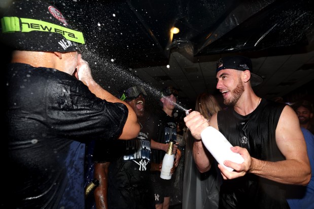 NEW YORK, NEW YORK - SEPTEMBER 30: Cody Bellinger #35 of the New York Yankees celebrates in the clubhouse after defeating the Boston Red Sox in game two of the American League Wild Card Series at Yankee Stadium on September 30, 2026 in the Bronx borough of New York City. (Photo by Caleb Bowlin/Getty Images)