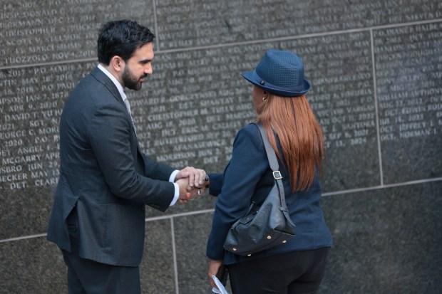 NEW YORK, NEW YORK - OCTOBER 13: Mayor Zohran Mamdani shakes hands with the family of fallen NYPD officers as they attend a ceremony at the NYPD Memorial Wall on October 13, 2026 in New York City. Mayor Mamdani was joined by New York Police Commissioner Jessica Tisch as added names of 42 fallen NYPD officers are unveiled at the memorial wall. The wall honors every NYPD officer who dies in the line of duty. (Photo by Michael M. Santiago/Getty Images)