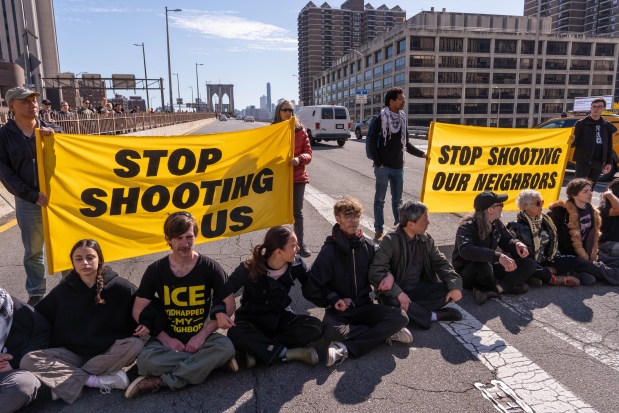 Protestors block the Brooklyn Bridge as they demonstrate for Oscar Belgal, who was shot by ICE, on Oct. 28, 2026, in New York City. (Photo by Adam Gray/Getty Images)