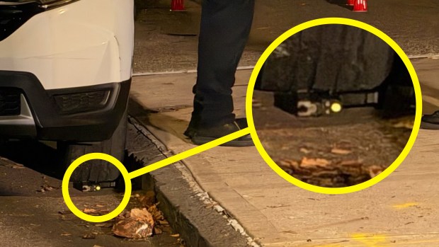 Police on the scene where an innocent 12-year-old girl was struck twice in a shooting in the Bronx on Tratman Ave. near Rowland St. in Westchester Square on Monday, Oct. 12, 2026. A gun is seen under a tire near where the shooting took place.