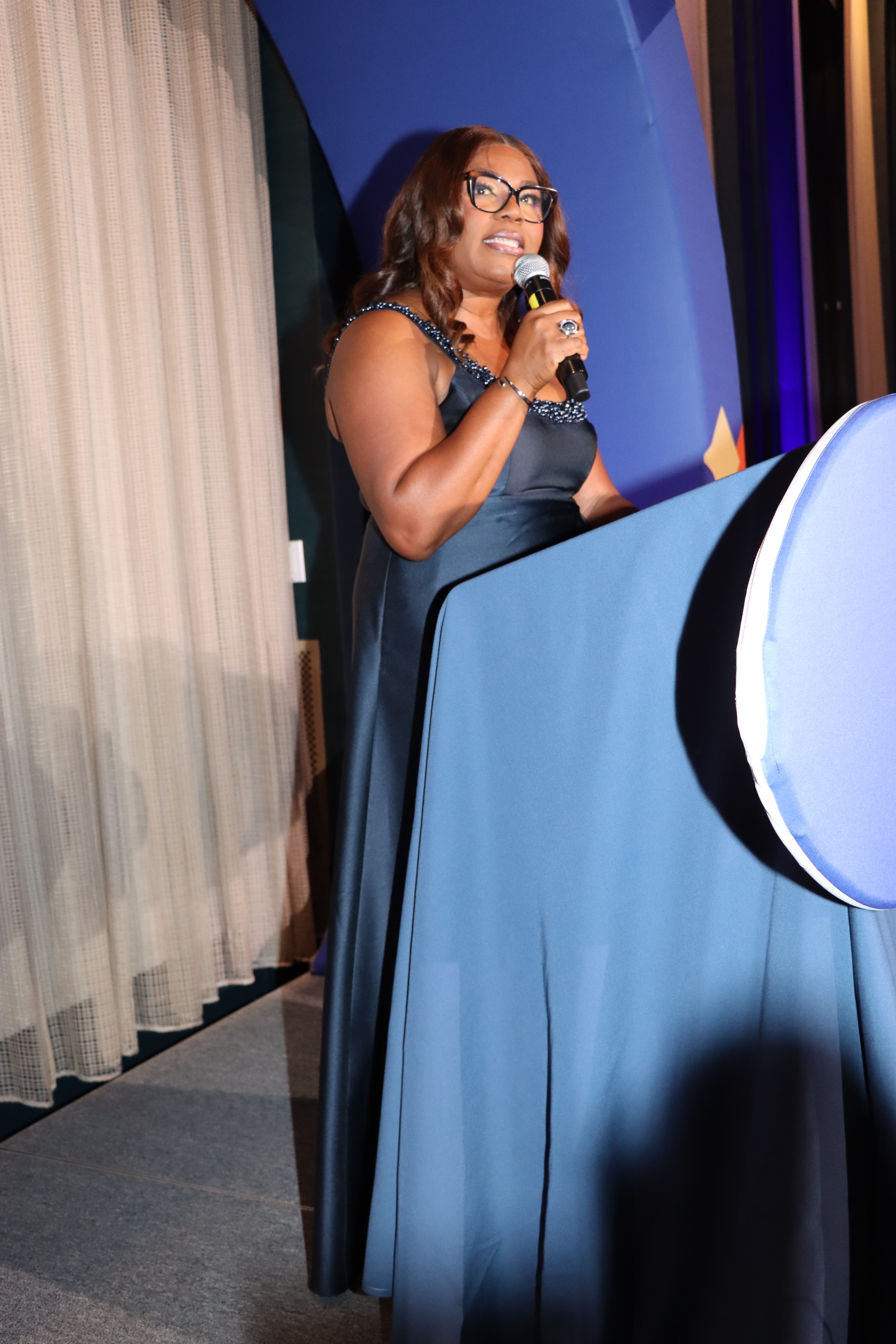 Sherly Demosthenes-Atkinson, the Haitian-born president and CEO of CABS delivers opening remarks.