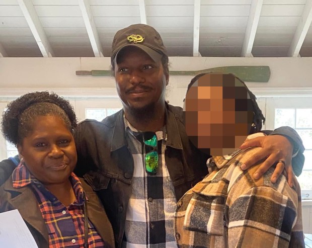 NYPD officers shot and wounded armed suspect Keegan Thomas (center) at a Queens home on Ocean Crest Blvd. near Hartman Ln. in Far Rockaway, where two of the suspect's relatives, including his mother (left), were found dead and a fire was started on Saturday, July 25, 2026. (Obtained by Daily News)
