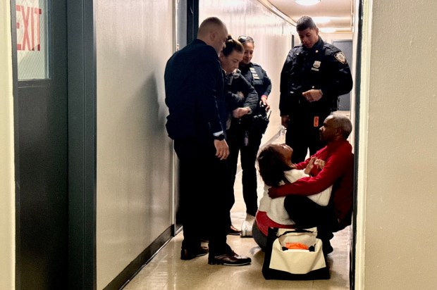 The mother of victim Nathaly Ramirez collapses outside her apartment on Olinville Ave. in the Bronx after learning of her daughter's death on Tuesday. (Rebecca White / New York Daily News)