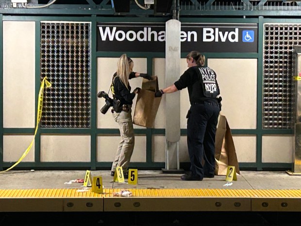 NYPD officers investigate after a man was fatally stabbed at the Woodhaven Blvd. subway station in Queens, New York, on Wednesday, Sept. 30, 2026. (Kerry Burke / New York Daily News)