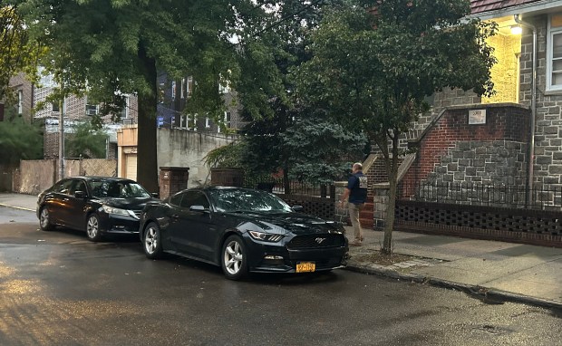 Police investigate after an off-duty NYPD detective was stabbed and wounded during an attempted robbery near his car parked black Mustang at E. 208th St. and Stueben Ave. in the Bronx on Friday, Oct. 2, 2026. (Kerry Burke / New York Daily News)