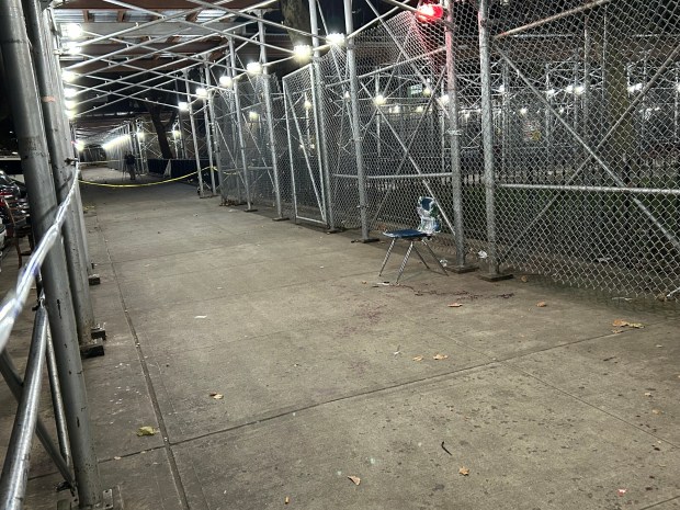 A 15-year-old boy was fatally shot and a 57-year-old man sitting in a plastic chair was wounded in a shooting on W. 115th St. near Malcolm X Blvd. inside NYCHA's Martin Luther King Jr. Towers on Wednesday, Oct. 7, 2026. (Kerry Burke / New York Daily News) 
