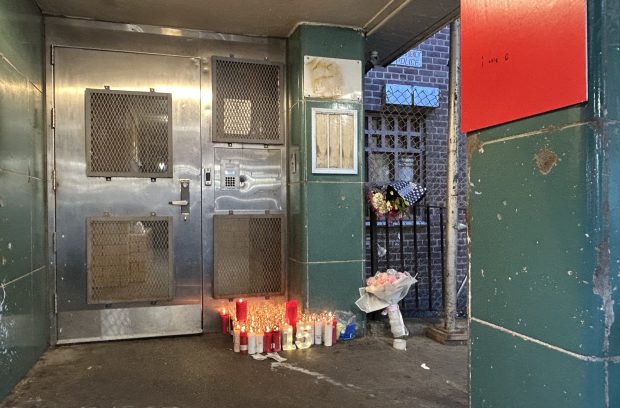 A makeshift memorial for Jihad Pack is pictured outside his home on W. 115 St. in NYCHA's Martin Luther King Towers on Oct. 8, 2026. (Kerry Burke / New York Daily News)
