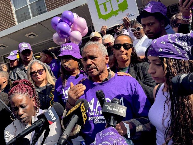 Nathaly Ramierz's grandfather, Leo Minaya, is pictured with family members during a vigil outside his granddaughter's apartment building on Olinville Ave. in the Bronx on Saturday, Oct. 10, 2026. (Rebecca White / New York Daily News)