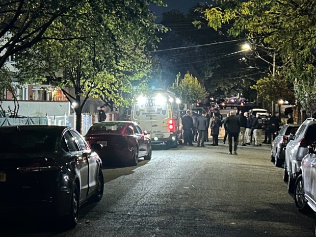Police investigate the scene of a police involved shooting. One woman shot by police and three stabbed inside a single family home on 149 St in Queens on Oct. 23, 2026. (Kerry Burke/New York Daily News)