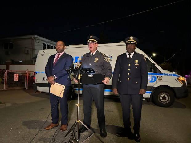 Officers speaking at the press conference after a police involved shooting. One woman shot by police and three stabbed inside a single family home on 149 St in Queens on Oct. 23, 2026. (Kerry Burke/New York Daily News)