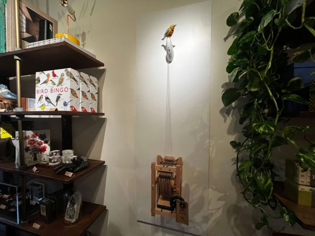 A singing and dancing bird automaton named "Molly" is pictured in Art of Play.
