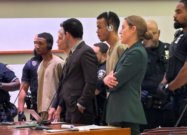 D'Angelo Carabello (far left in beige jumpsuit) and Sneider Mejia (center, beige jumpsuit) are pictured during their arraignments in Bronx Criminal Court on Wednesday, Oct. 14, 2026. (Roni Jacobson / New York Daily News)