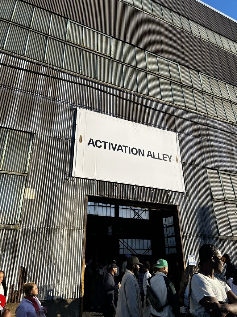 Attendees gather outside Activation Alley at CultureCon 2026 at the Brooklyn Navy Yard in Brooklyn, New York. Photo by Catherine Roth / The Haitian Times