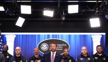 Secretary of Homeland Security Markwayne Mullin (center) spoke during a press conference at ICE headquarters Friday.