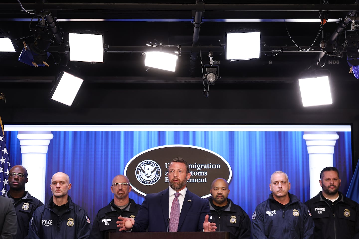 Secretary of Homeland Security Markwayne Mullin (center) spoke during a press conference at ICE headquarters Friday.