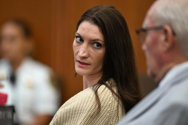 Lindsay Clancy, center, speaks with her lawyer during proceedings in her murder trial, Aug. 20, 2026, in Plymouth, Mass. (AP Photo/Josh Reynolds, Pool, File)