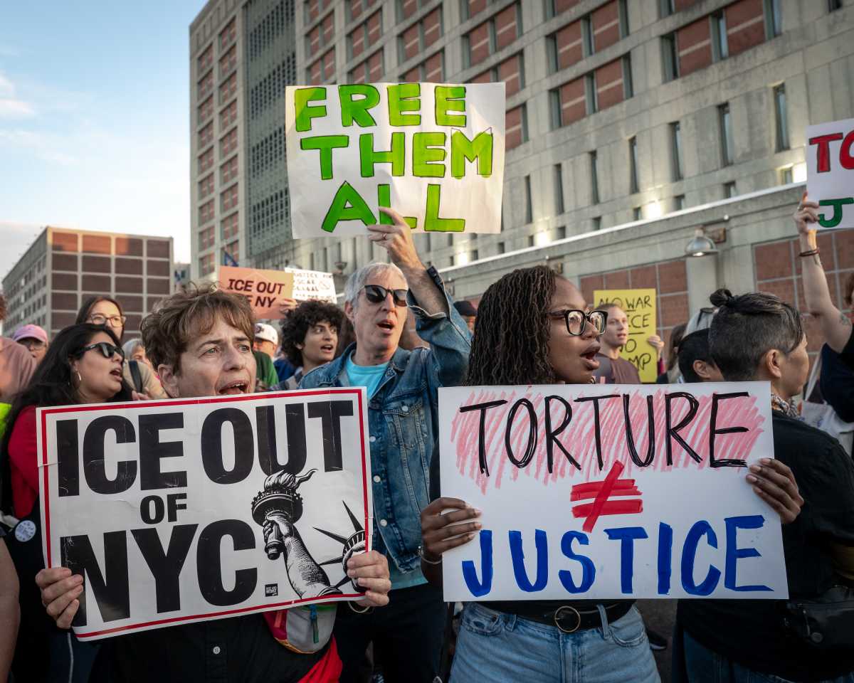 people rally outside MDC prison for oscar belgal
