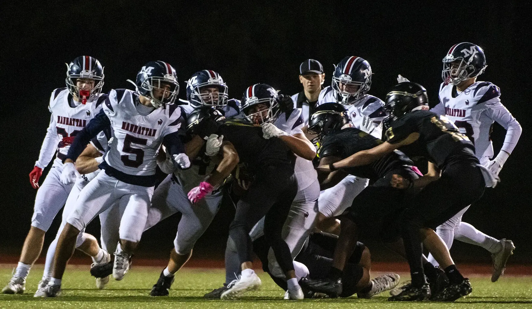 Manhattan High football blasts Topeka High 60-13