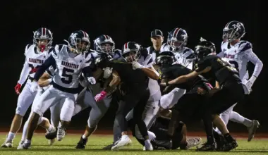 Manhattan High football blasts Topeka High 60-13