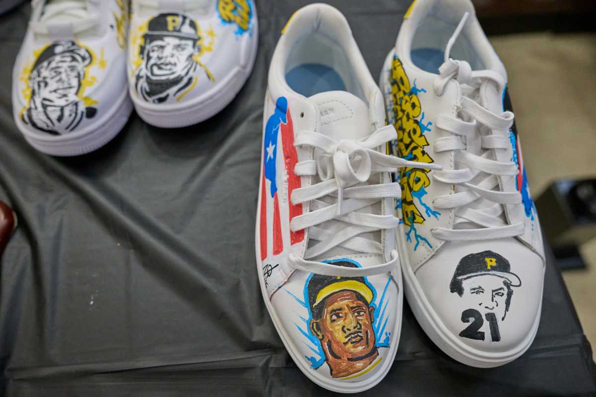 Hand-painted white sneakers featuring baseball player portraits, team logos, and patriotic designs.