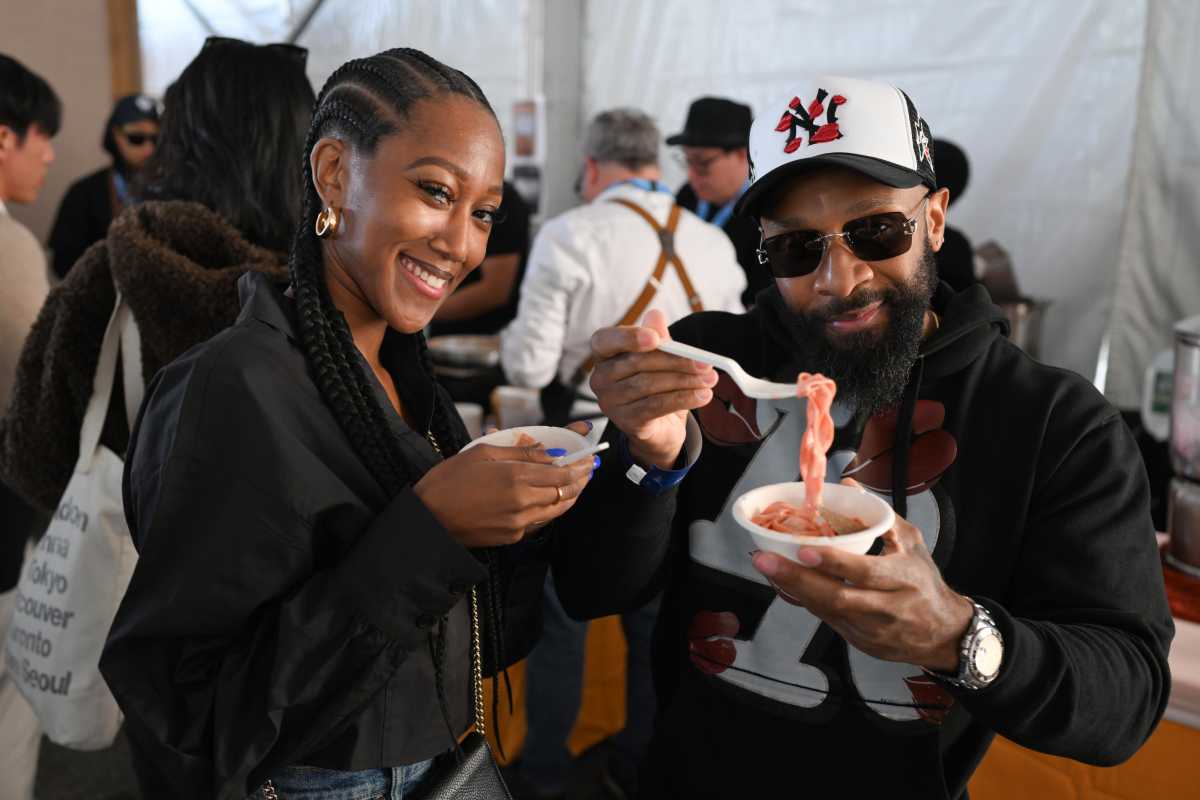 Guests attend the Food Network New York City Wine & Food Festival presented by Invesco QQQ - Southern Glazer's Wine & Spirits Trade Day hosted by Wine Spectator at Grand Tasting at Brooklyn Army Terminal on October 18, 2024 in New York City.  