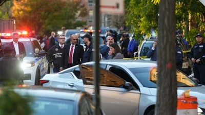 Members of law enforcement gather at the scene after a shooting reportedly involving US Immigration and Customs Enforcement (ICE) officers in the Bronx borough of New York City, on Thursday, (REUTERS)