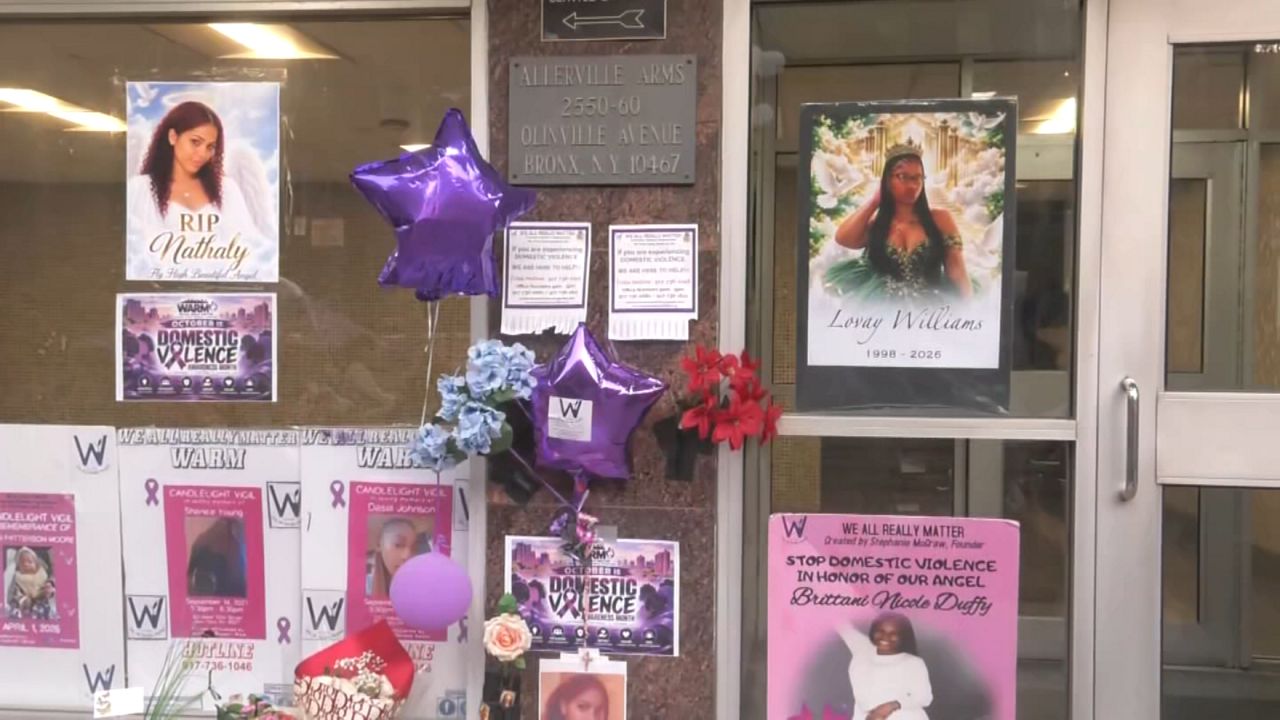 Community holds vigil for woman pushed from balcony
