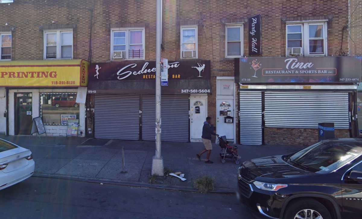 scene in Queens where man was stabbed dead. closed restaurant with gate rolled down