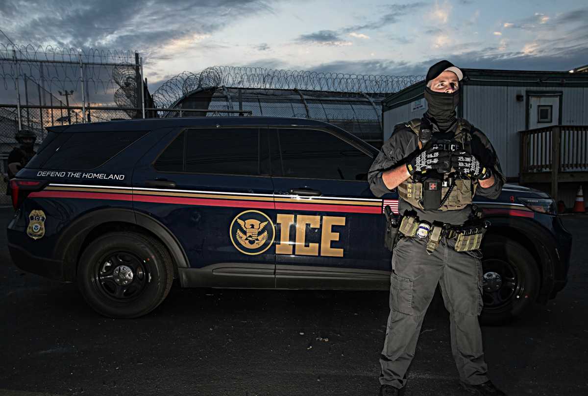 ICE agent near vehicle