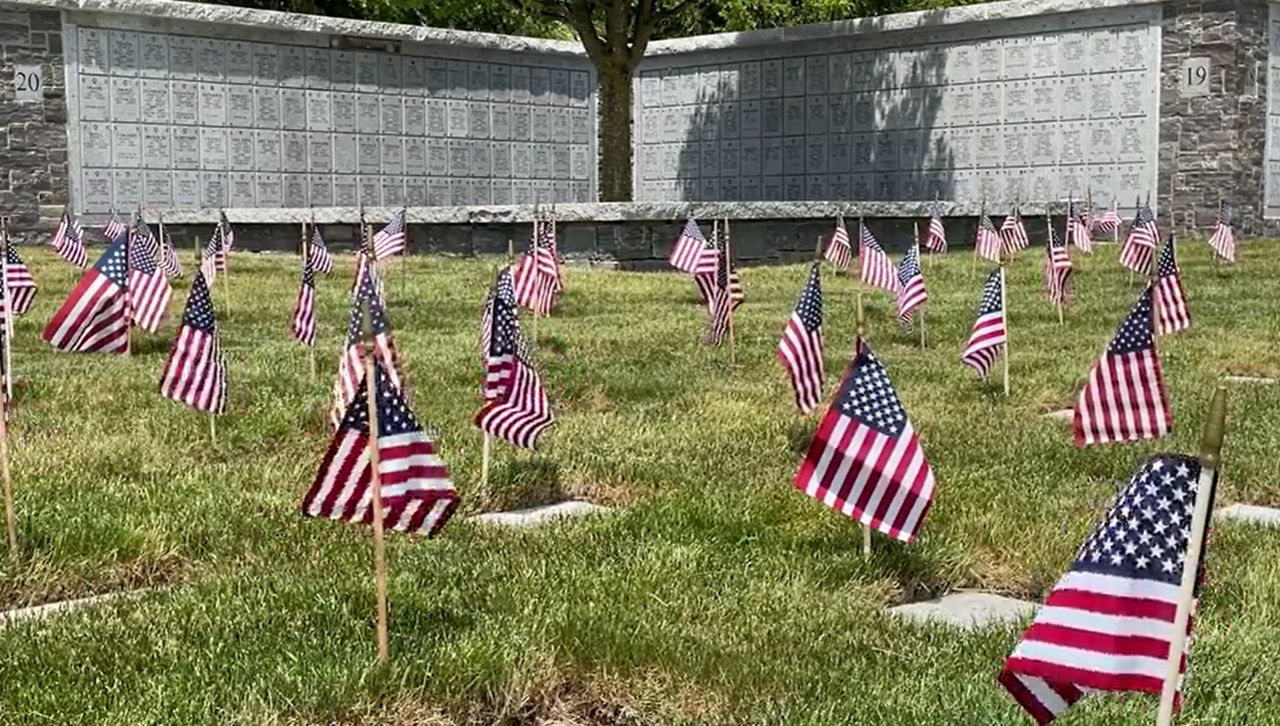 small flags at burial vault