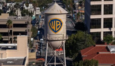 In an aerial view, the Warner Bros. water tower has "A Skydance Corporation" added to it at Warner Bros. Studio on October 06, 2026 in Burbank, California. Paramount Skydance completed its $110 billion acquisition of Warner Bros. Discovery, creating a new global entertainment company called Skydance that combines major film studios, streaming services Paramount+ and HBO Max, and news networks CBS and CNN. (Credit: Justin Sullivan/Getty Images)