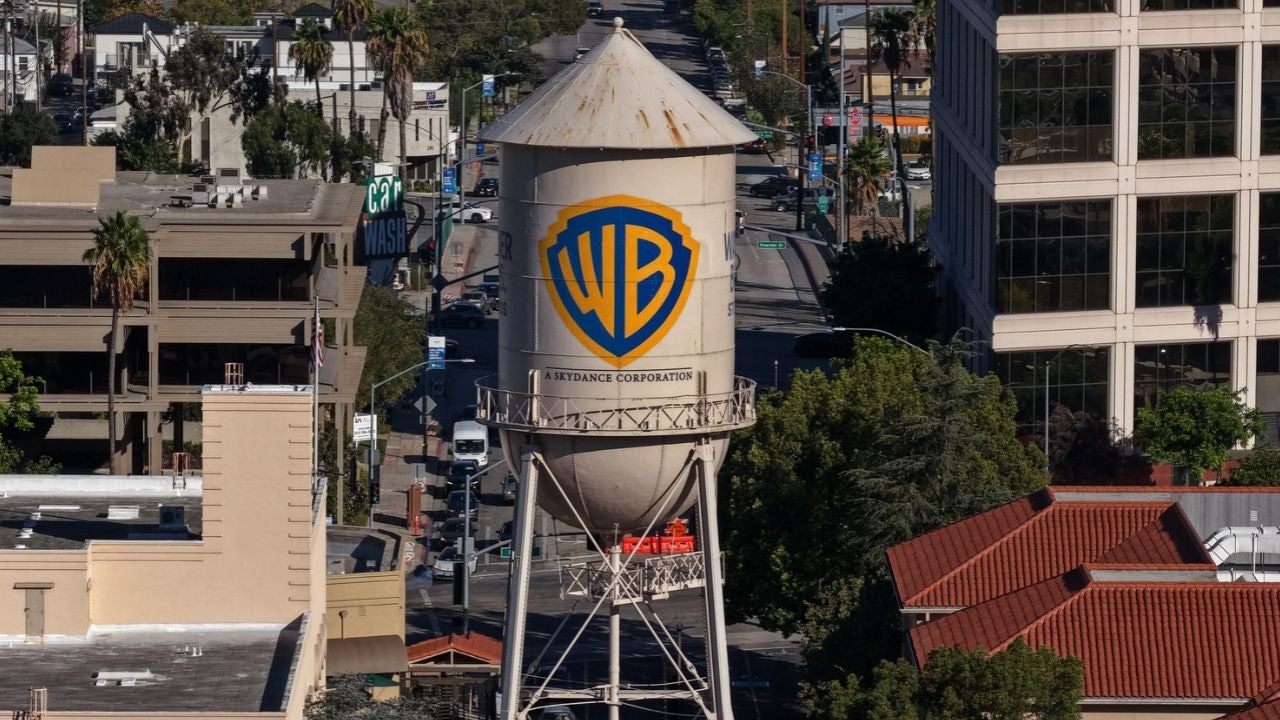 In an aerial view, the Warner Bros. water tower has "A Skydance Corporation" added to it at Warner Bros. Studio on October 06, 2026 in Burbank, California. Paramount Skydance completed its $110 billion acquisition of Warner Bros. Discovery, creating a new global entertainment company called Skydance that combines major film studios, streaming services Paramount+ and HBO Max, and news networks CBS and CNN. (Credit: Justin Sullivan/Getty Images)