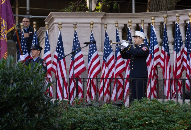 FDNY Bat. Chief Anthony Holz plays taps during the FDNY Annual Memorial Service at the Fireman's Monument Wednesday, October, 7, 2026 in Manhattan, New York. (Barry Williams/ New York Daily News)
