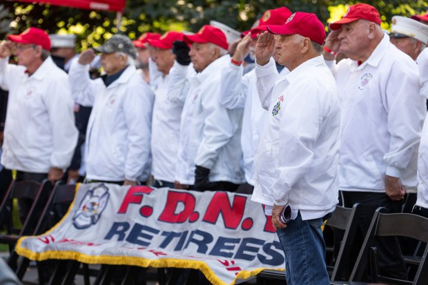 Retired FDNY members salute during the FDNY Annual Memorial Service at the Fireman's Monument at the Fireman's Monument Wednesday, October, 7, 2026 in Manhattan, New York. (Barry Williams/ New York Daily News)