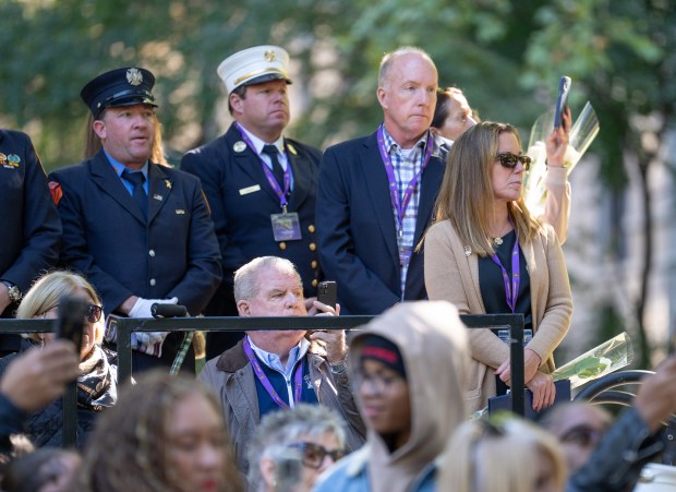 Lt. Patrick Brady's widow, Kara Brady, watches the review during the FDNY Annual Memorial Service at the Fireman's Monument Wednesday, October, 7, 2026 in Manhattan, New York. (Barry Williams/ New York Daily News)