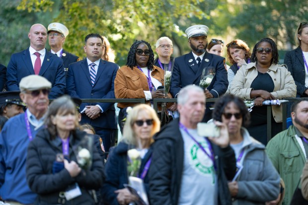 The widow of FDNY Paramedic Salih A. Abdur-Rahman, Nura Abdul-Karim watches the review during the FDNY Annual Memorial Service at the Fireman's Monument Wednesday, October, 7, 2026 in Manhattan, New York. (Barry Williams/ New York Daily News)