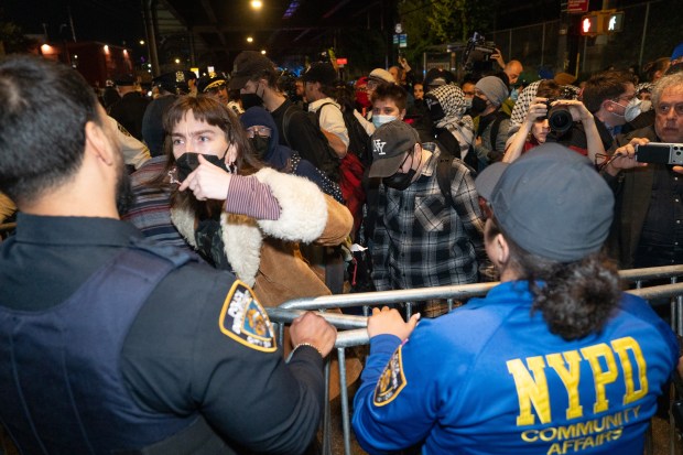Protestors struggle for control of barricades with NYPD officers outside New York- Presbyterian Allen Hospital after ICE agents shot and wounded a man on Marble Hill Ave. near W. 225th St. on Thursday, Oct. 8, 2026 in the Bronx. (Barry Williams/ New York Daily News)