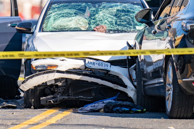Police investigate after a white Mercedes struck three pedestrians, killing two, on Allerton Ave. in the Bronx on Friday, Oct. 9, 2026. (Theodore Parisienne / New York Daily News)