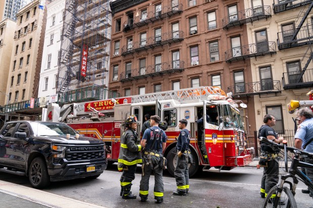 Two people were critically injured in a fire that ripped through the fifth floor of an apartment building on W. 49th St. near Eighth Ave. in Hells Kitchen, Manhattan, on Saturday, Oct. 17, 2026. (Theodore Parisienne / New York Daily News)
