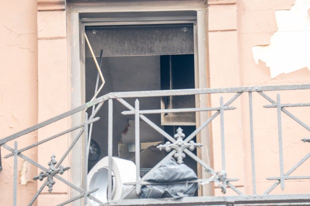 Two people were critically injured in a fire that ripped through the fifth floor of an apartment building on W. 49th St. near Eighth Ave. in Hells Kitchen, Manhattan, on Saturday, Oct. 17, 2026. (Theodore Parisienne / New York Daily News)