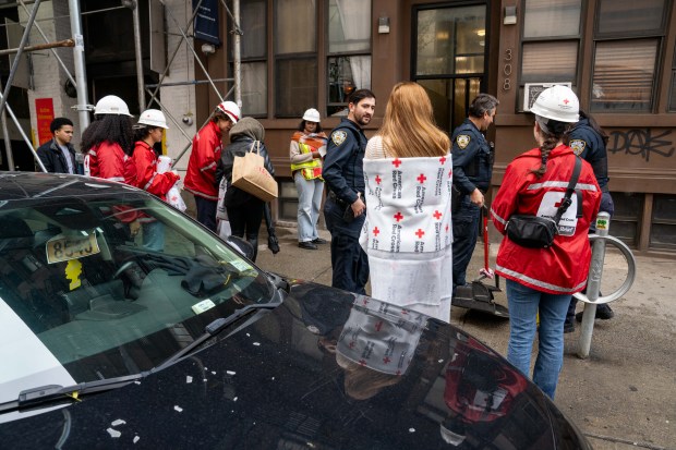 Two people were critically injured in a fire that ripped through the fifth floor of an apartment building on W. 49th St. near Eighth Ave. in Hells Kitchen, Manhattan, on Saturday, Oct. 17, 2026. (Theodore Parisienne / New York Daily News)