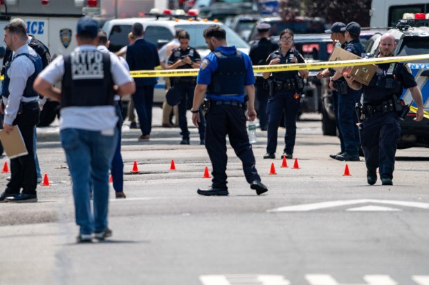 NYPD officers shot and wounded armed suspect Keegan Thomas at a Queens home on Ocean Crest Blvd. near Hartman Ln. in Far Rockaway, where two of the suspect's relatives were found dead and a fire was started on Saturday, July 25, 2026. (Theodore Parisienne / New York Daily News)