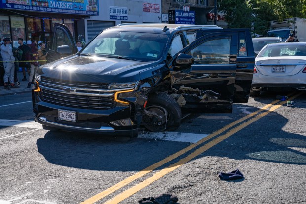 Police investigate after a white Mercedes struck three pedestrians, killing two, on Allerton Ave. in the Bronx on Friday, Oct. 9, 2026. (Theodore Parisienne / New York Daily News)