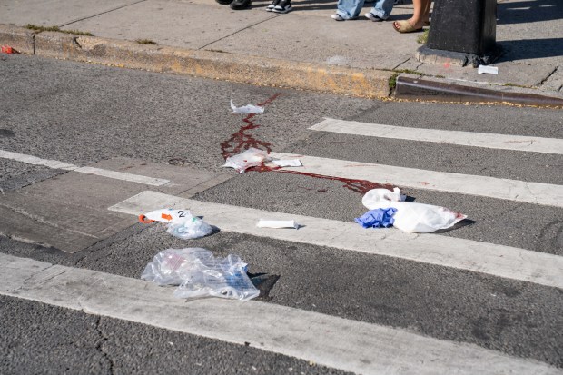 Police investigate after a white Mercedes struck three pedestrians, killing two, on Allerton Ave. in the Bronx on Friday, Oct. 9, 2026. (Theodore Parisienne / New York Daily News)