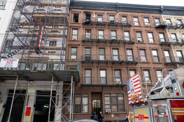 Two people were critically injured in a fire that ripped through the fifth floor of an apartment building on W. 49th St. near Eighth Ave. in Hells Kitchen, Manhattan, on Saturday, Oct. 17, 2026. (Theodore Parisienne / New York Daily News)