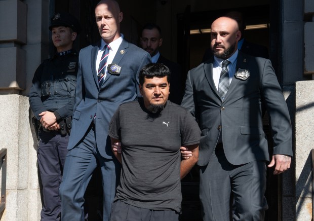 Rogelio Lozano Garita is pictured in police custody leaving the NYPD's 101st Precinct stationhouse in Queens on Tuesday, Oct. 27, 2026. Lozano Garita is accused of killing Seraphina Pereira, who was found decomposing in Rockaway Community Park near Beach 58th St. and Almeda Ave. in the Rockaways. (Barry Williams/ New York Daily News)